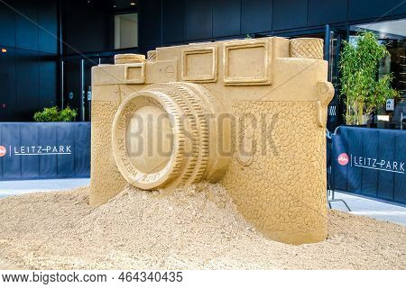 Wetzlar, Germany - 2021-10-01:  Leica Store In Wetzlar With Artwork, Leica Camera Modeled From Sand.