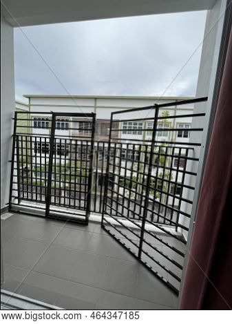 Mantin, Negeri Sembilan - October 27, 2022: Site Workers Leave The Window Grille To Be Installed In 