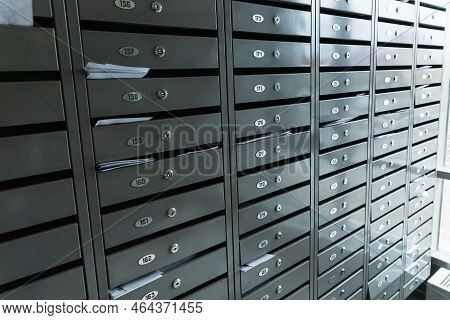 Metal Mailboxes A Lot. Residential Metal Postboxes With Apartment Numbers At Modern Multifamily Buil
