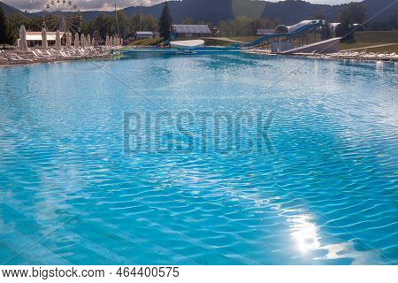 08.18.2022, Aya, Altai Krai, Russiaa Large Swimming Pool With Clear Water In The Open Air Against Th