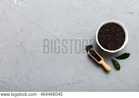Quinoa Seeds In Bowl And Spoon On Colored Background. Healthy Kinwa In Small Bowl. Healthy Superfood