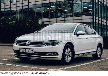 Moscow, Russia - October 2022: White Car Volkswagen Passat B8 Is Parked On The Parking In Front Of G