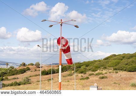 Wind Sock Fly. Summer Hot Day On Private Sporty Airport With Abandoned Windsock, Wind Is Blowing And