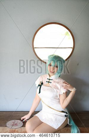 Japan Anime Cosplay Portrait Of A Girl With Chinese Dress Costume In Chinese Garden