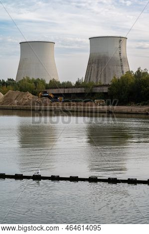 Zemst, Flemish Brabant Region, Belgium, 10 30 2022 - Cooling Towers Of A Power Plant Reflecting In T