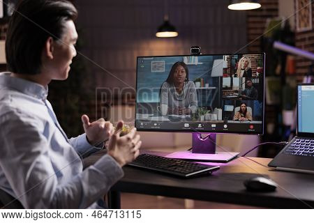 Male Employee Attending Videocall Business Meeting On Computer, Talking To People On Online Videocon
