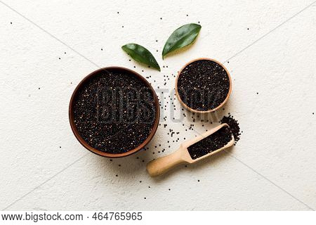 Quinoa Seeds In Bowl And Spoon On Colored Background. Healthy Kinwa In Small Bowl. Healthy Superfood