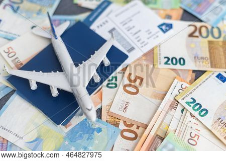 Toy Plane On Euro Cash Background, Travel With Airplane. Conceptual Image Of The Price Of Airline Ti