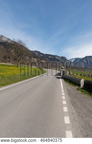 Maienfeld, Grison, Switzerland, April 11, 2022 Empty Street Along The Alpine Area On A Sunny Day In 