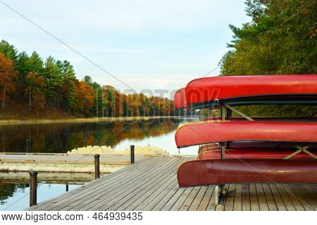 Overcast Day With Rack Of Red Canoes On Dock Of Old Ausable Channel River In The Pinery Provincial P