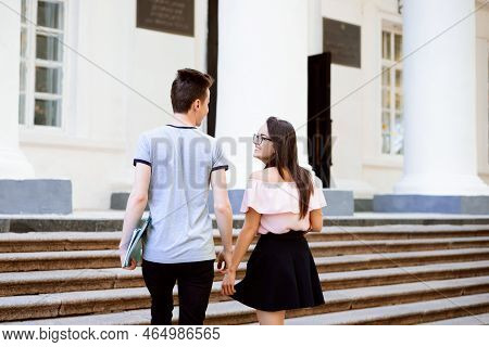 A Group Of Young Students Go To Classes. Intelligent Students Do Not Skip Classes And Attend Them Re