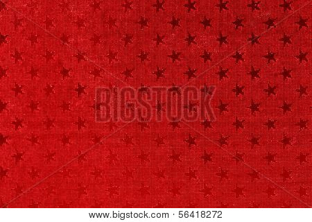 Asteriscos sobre fundo vermelho.