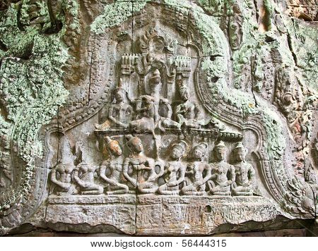 Ancient carving on the wall of Prasat Ta Prum Temple in Siem Reap, Cambodia.