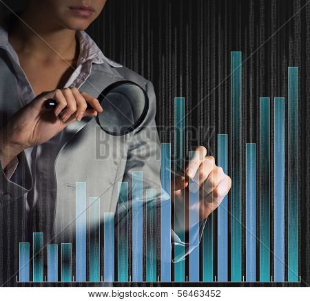 business woman draws a graph