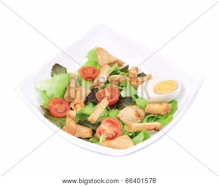 Caesar salad with eggs and tomatoes.