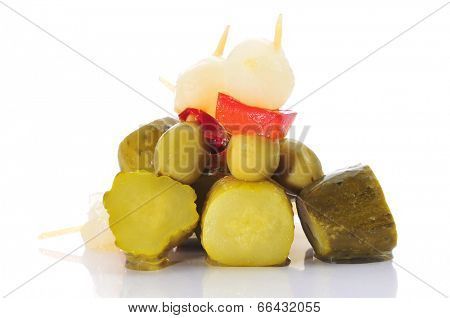 spanish banderillas, skewers with different pickles, such as olives, garlic, cucumbers, onion and red pepper