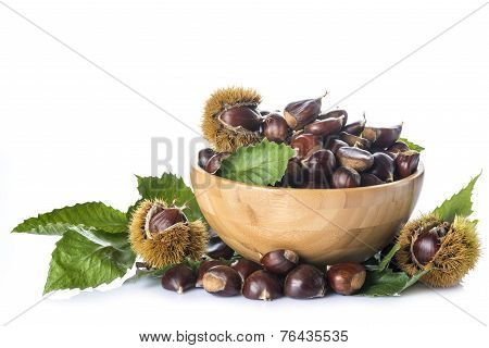 Chestnuts In A Wooden Bowl Isolated On A White Background