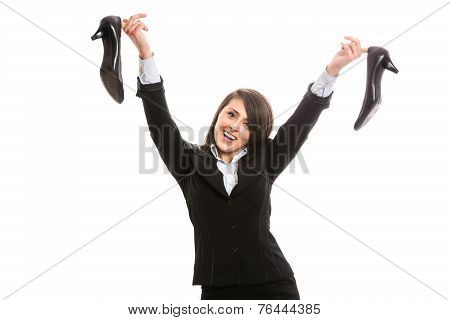 Young businesswoman with high heels after work