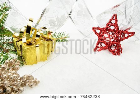 Gold Christmas Gifts With Silver Ribbon And Needles Fir With Red