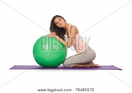 Young woman exercising with swiss ball