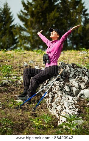 Happy hiker enjoying sun
