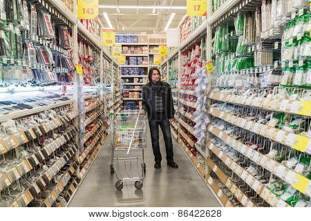 MOSCOW, RUSSIA - MARCH 03, 2015. man makes purchase of Leroy Merlin Store. Leroy Merlin is a French