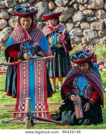 Cuzco, Peru - July 15, 2013: women weaving in the peruvian Andes at Cuzco Peru on july 15th, 2013