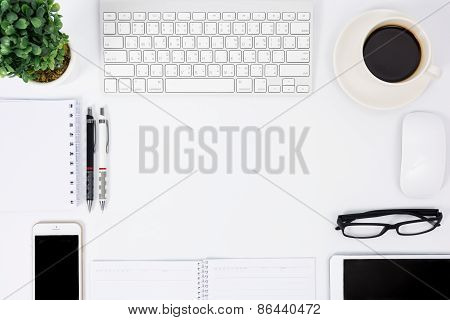 Business Desk With A Keyboard, Mouse And Pen