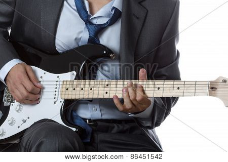 Man In Suit Playing Electric Guitar Isolated On White