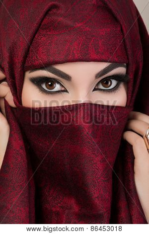 Portrait Of Beautiful Arabian Girl Hiding Her Face