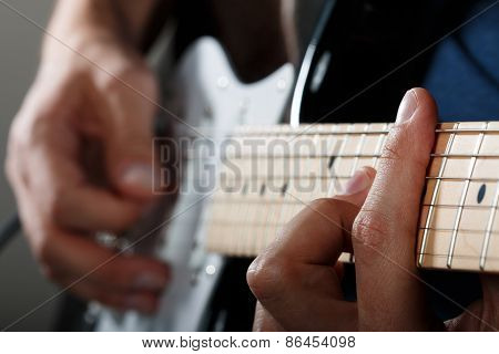 Hands Of Man Playing Electric Guitar