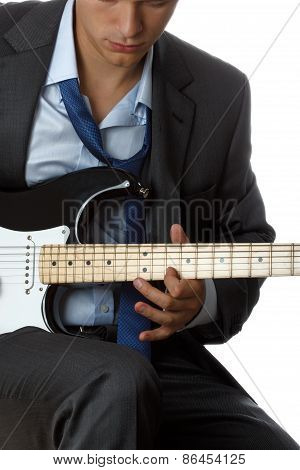 Man In Suit And Tie Playing Electric Guitar