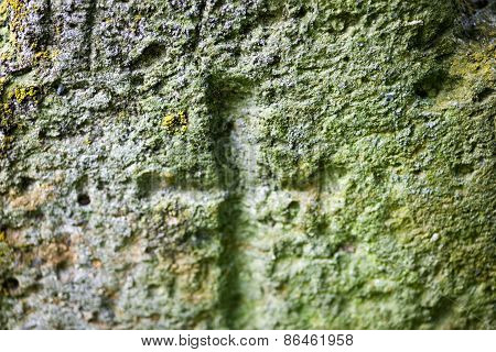 Engraved Cross On The Old Stone Surface