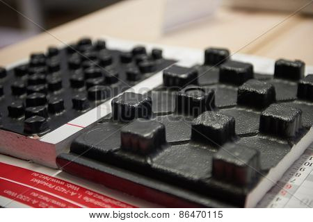 Black underfloor heating posed in a under construction building