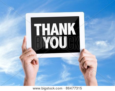 Tablet pc with text Thank You with sky background