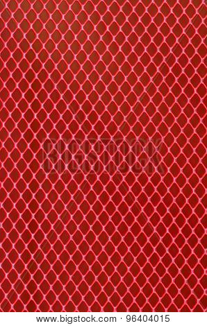 Background of red steel grating. Metallic background.