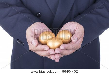 Businessman Showing Golden Egg. Concept Business