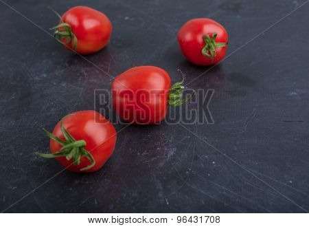 Ripe Red Tomatoes On Black Table