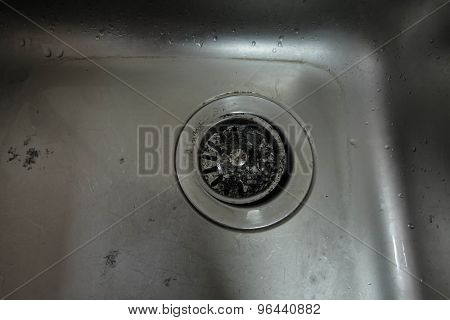 Old dirty stainless sink in kitchen