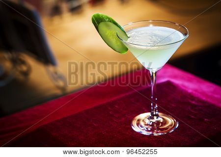 Blue Curacao And Lime Martini In Bar At Night