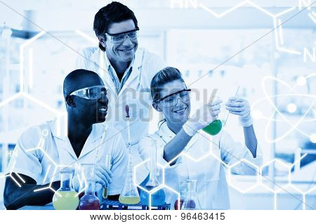 Science graphic against scientists examining a testtube
