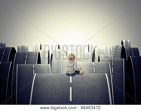 little child and abstract 3d roads