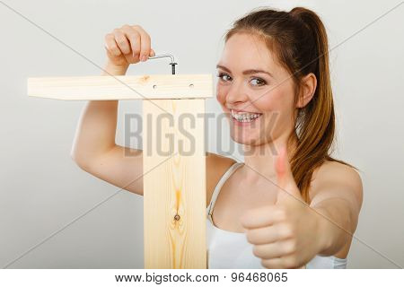 Success Ful Woman Assembling Furniture. Diy.