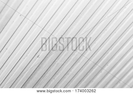 The grey color of figure of corrugated texture. Concept: reliable abstract creative art fence.