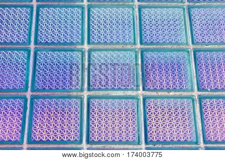 Decorative and glossy glass block window as a texture or for background. The wall. Geometric background.