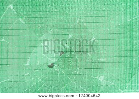 Broken decorative and glossy glass block window as a texture or for background. The wall. Geometric background.