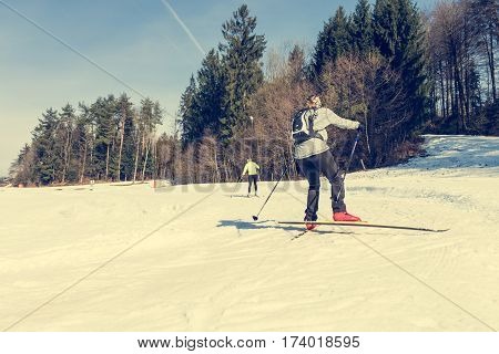 Cross country skiing. Skiiers enjoying ending winter.