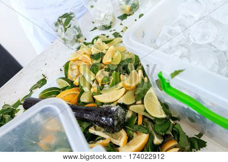 Fresh chopped ingredients for a refreshing cocktail with ice