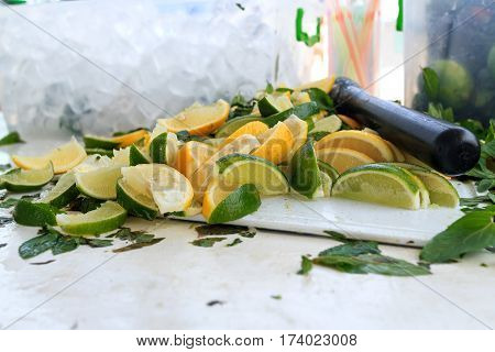 Fresh chopped ingredients for a refreshing cocktail with ice