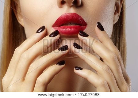 Close-up Of Woman's Lips With Fashion Red Make-up And Manicure. Beautiful Female Full Lips With Perf